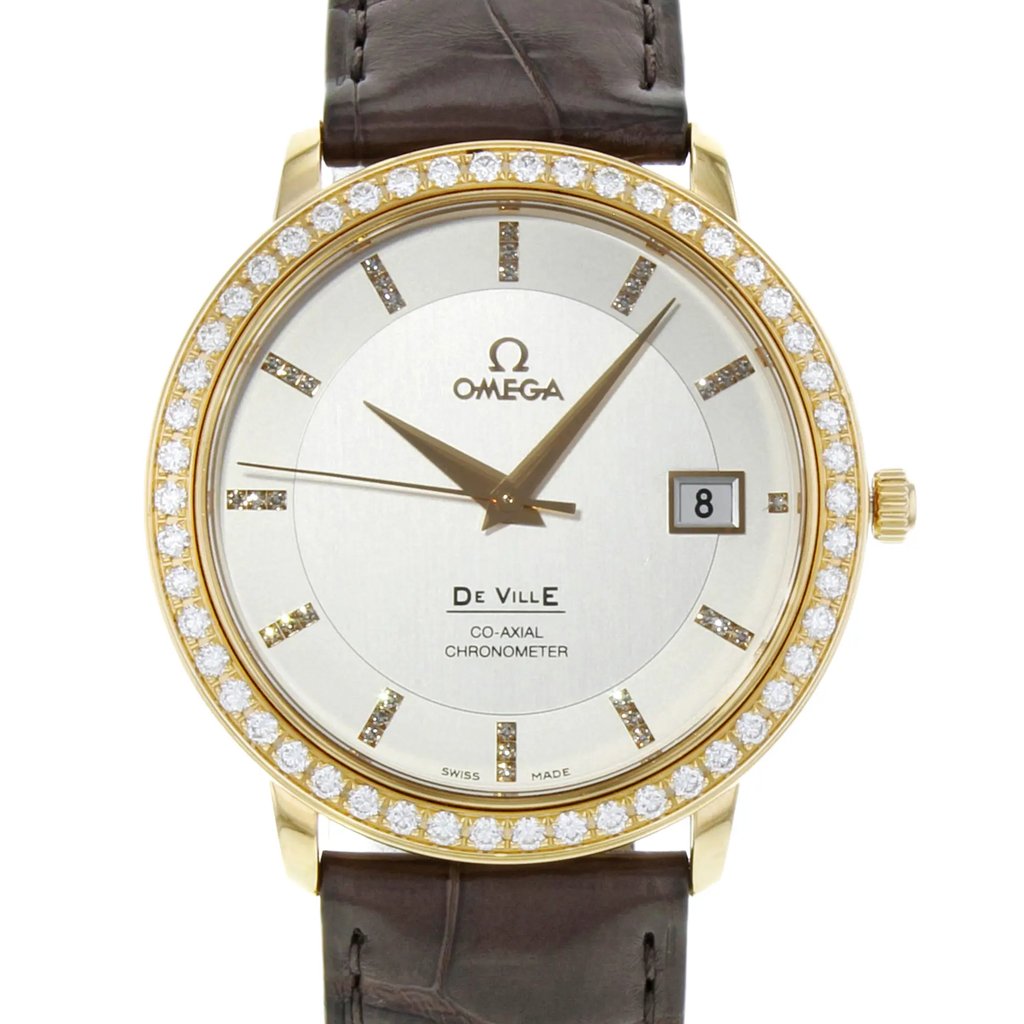 An image of a men's OMEGA wristwatch viewed from the front, positioned centrally and captured at a close distance. The watch features a rose gold case with a diamond-studded bezel, a silver dial, and a brown leather strap. The hands and hour markers are gold-toned, and the watch includes a date window at 3 o'clock. The angle showcases the intricate details of the watch face and the elegant design.