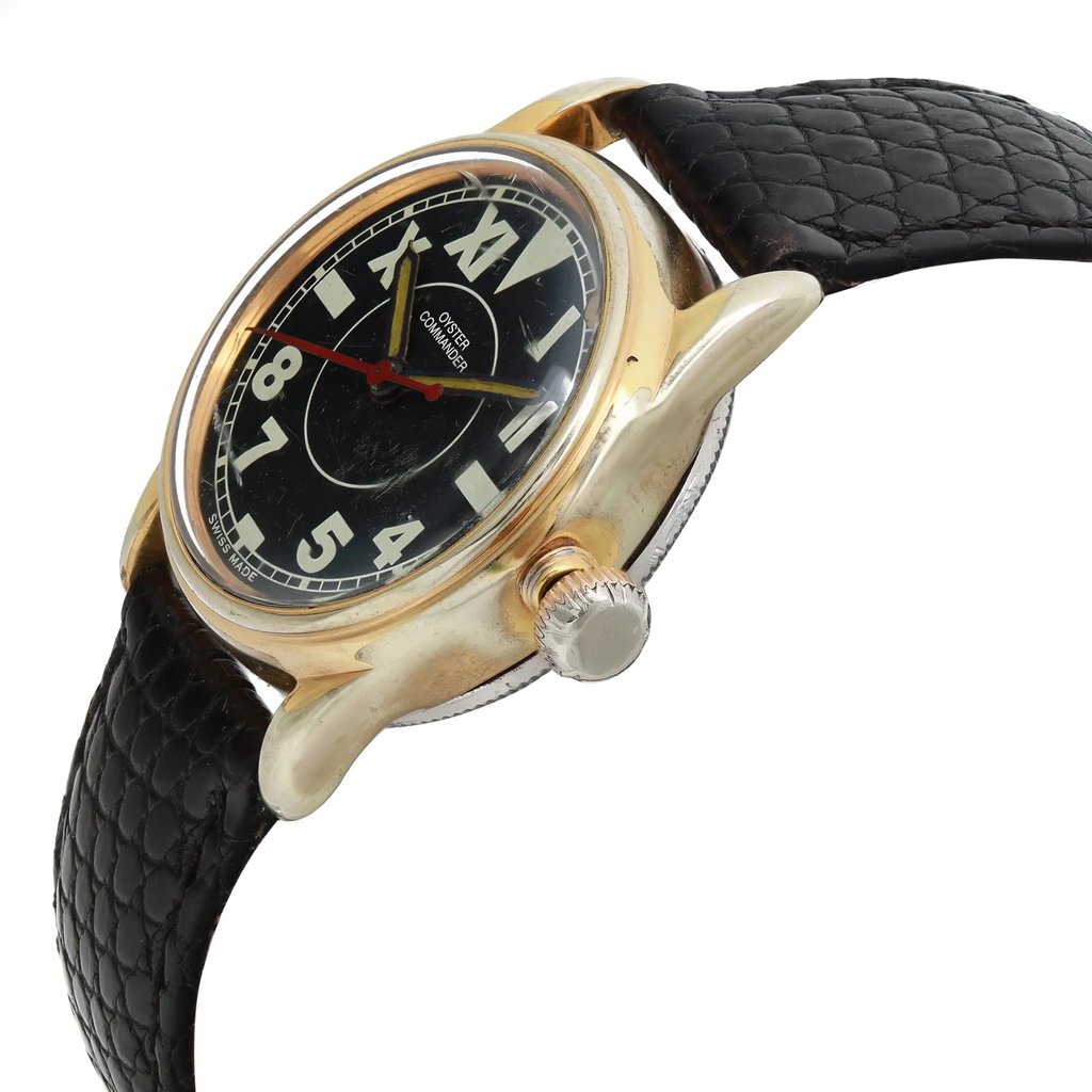 An image of a pre-owned women's Rolex wristwatch. The watch is positioned at a slight angle, viewed from the front and right side, showcasing its gold casing and black leather strap. The close-up perspective highlights the watch's black dial with bold, white numerals and a red second hand. The crown is visible on the right side.
