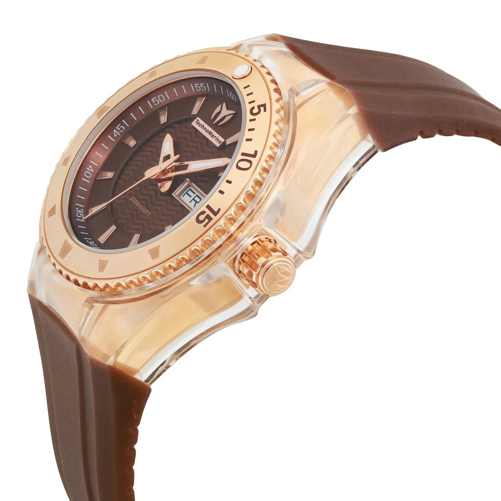 An image of a Wristwatch by TechnoMarine. This Pre Owned item is designed for Women, featuring a Sport style. It has a Quartz movement and an Analog display with a Brown dial color. The indices include 12-Hour Dial,Seconds Hand. The band is made of Silicone and the case is made of Stainless Steel. The watch has a Round shape with a case size of 34 mm and a case thickness of 12.4 mm.