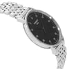 An image of a Wristwatch by Tissot. This New item is designed for Men, featuring a Casual style. It has a Quartz movement and an Analog display with a Rhodium dial color. The indices include 12-Hour Dial,Arabic Numerals. The band is made of Stainless Steel and the case is made of Stainless Steel. The watch has a Round shape with a case size of 42 mm and a case thickness of 6 mm.