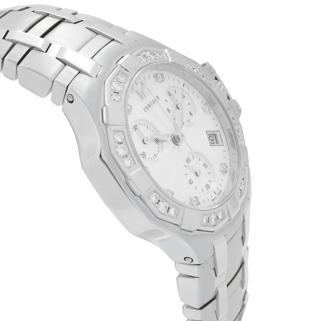 An image of a pre-owned wristwatch taken from a side profile view, opposite the crown. The angle showcases the watch's metal bracelet and the detailed face with multiple subdials, viewed at a close distance. The bezel is adorned with sparkling stones, adding an elegant touch to the design.