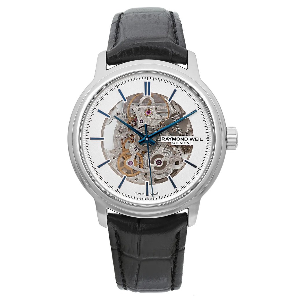 An image of a Wristwatch by RAYMOND WEIL. This Pre Owned item is designed for Men, featuring a Casual style. It has a Mechanical (Automatic) movement and an Analog display with a Silver dial color. The indices include 12-Hour Dial,Stick Indexes. The band is made of Leather and the case is made of Stainless Steel. The watch has a Round shape with a case size of 39 mm and a case thickness of 9 mm.