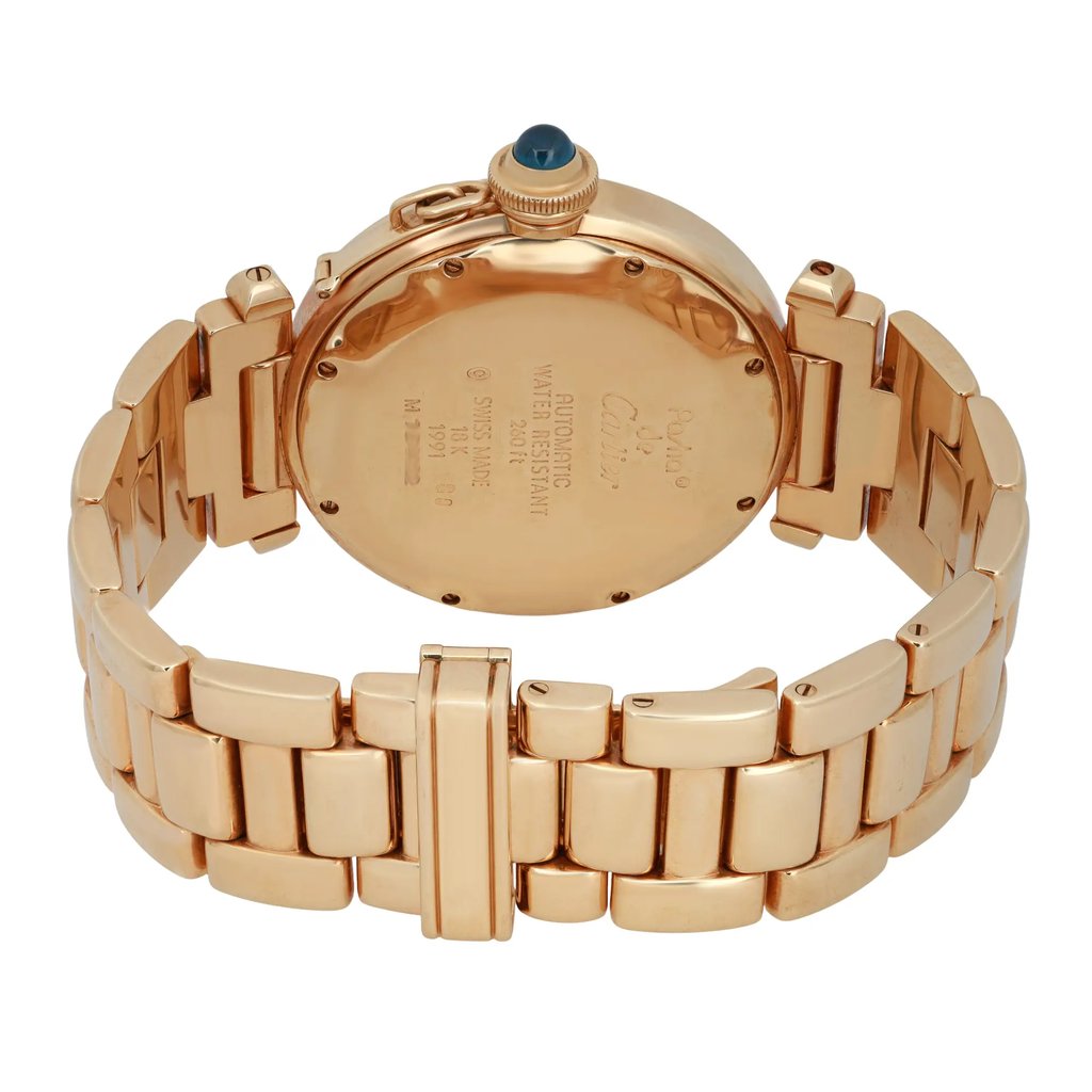 An image of a pre-owned men's Cartier wristwatch, captured from a slightly elevated angle focusing on the back. The watch features a gold-tone metal bracelet and a round case with engraved details. The crown is adorned with a blue cabochon. The bracelet is laid out in a semi-circle, showcasing its links and clasp, with the watch positioned at a close distance for detailed viewing.