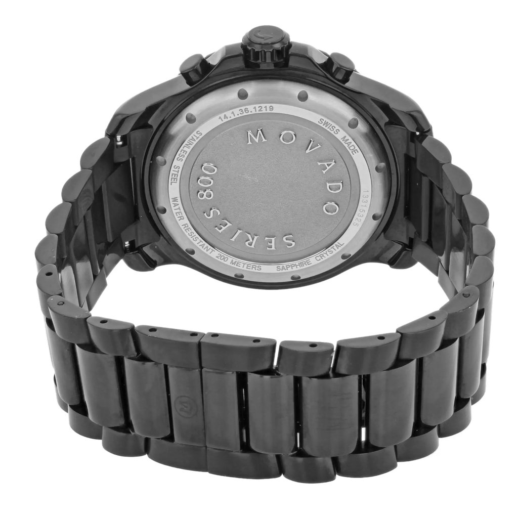 An image of a pre-owned wristwatch taken from the back view, showcasing the closed clasp. The watch features a dark metal band with a smooth finish. The brand name and model details are engraved on the back of the watch case. The angle provides a close-up view, emphasizing the craftsmanship and design of the clasp and links.