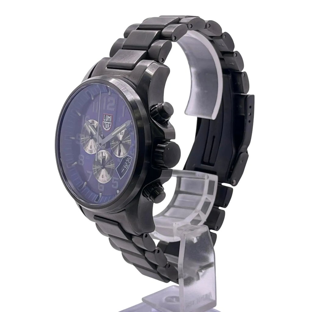 An image of a Wristwatch by Luminox. This Pre Owned item is designed for Men, featuring a Dress/Formal style. It has a Quartz movement and an Analog display with a Blue dial color. The indices include 12-Hour Dial,Arabic Numerals,Easy to Read/Large Numerals,Multi Dial. The band is made of Stainless Steel and the case is made of Stainless Steel. The watch has a Round shape with a case size of 42 mm and a case thickness of 14 mm.