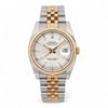 An image of a pre-owned men's Rolex Datejust 36mm Steel 18K Yellow Gold Silver Dial Watch 116233, positioned upright and photographed from a front-facing angle at a close distance. The watch features a stainless steel and gold two-tone bracelet and a dial with luminous hands and a date indicator set to the 25th. The bezel is gold with a fluted design, and the dial is marked with Roman numerals.