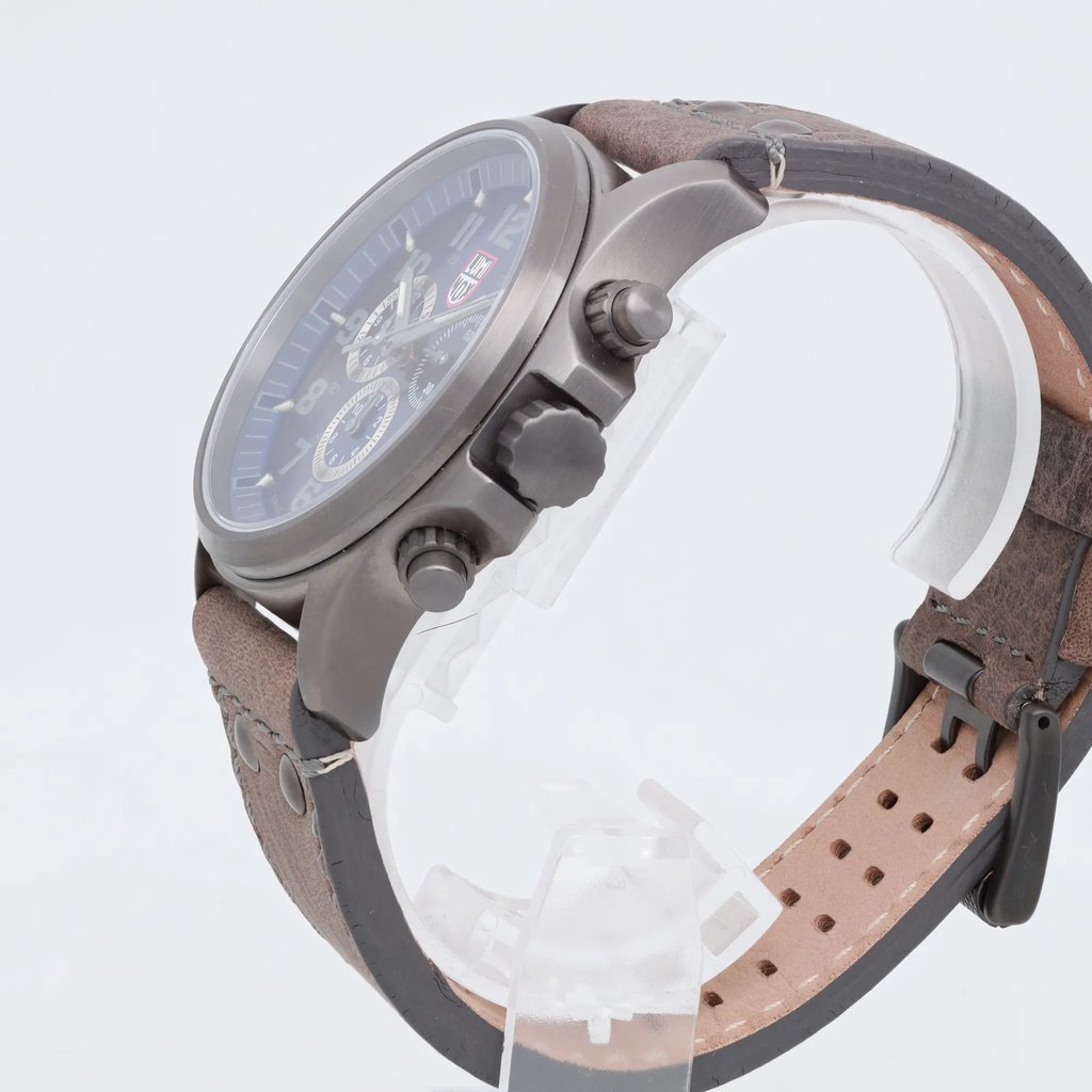 An image of a Wristwatch by Luminox. This Pre Owned item is designed for Men, featuring a Casual style. It has a Quartz movement and an Analog display with a Blue dial color. The indices include 12-Hour Dial,Arabic Numerals,Multi Dial. The band is made of Leather and the case is made of Stainless Steel. The watch has a Round shape with a case size of 45 mm and a case thickness of 14 mm.