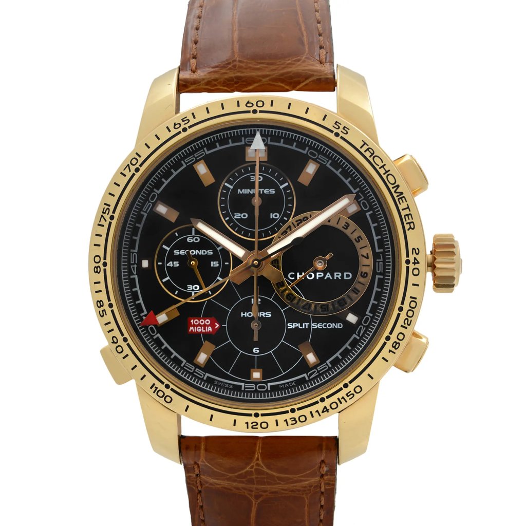 An image of a pre-owned Chopard men's wristwatch, positioned upright with a front-facing angle. The watch features a yellow gold case and a brown leather strap. The black dial includes a chronograph, date indicator, luminous hands, and a small seconds subdial, all visible at close range.