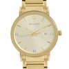 An image of a pre-owned men's Bulova wristwatch in good condition, featuring a close-up frontal view of the round watch face at a direct angle. The dial displays a champagne sunburst pattern with gold-tone non-numeric hour marks and luminous hands. A date indicator is positioned at the 3 o'clock mark. The case and band are made of stainless steel with a gold-tone finish, and the bezel color matches the band. The watch is designed in a dress/formal style.