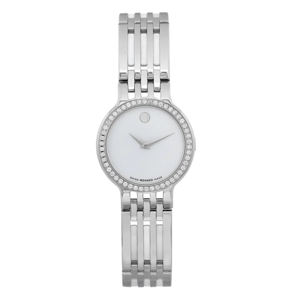 An image of a pre-owned women's Movado wristwatch, shown from a direct front-facing angle at a close distance. The watch features a sleek, metallic bracelet and a round, minimalist face with a single dot at the 12 o'clock position. The bezel is adorned with small, sparkling stones, adding an elegant touch to the design.
