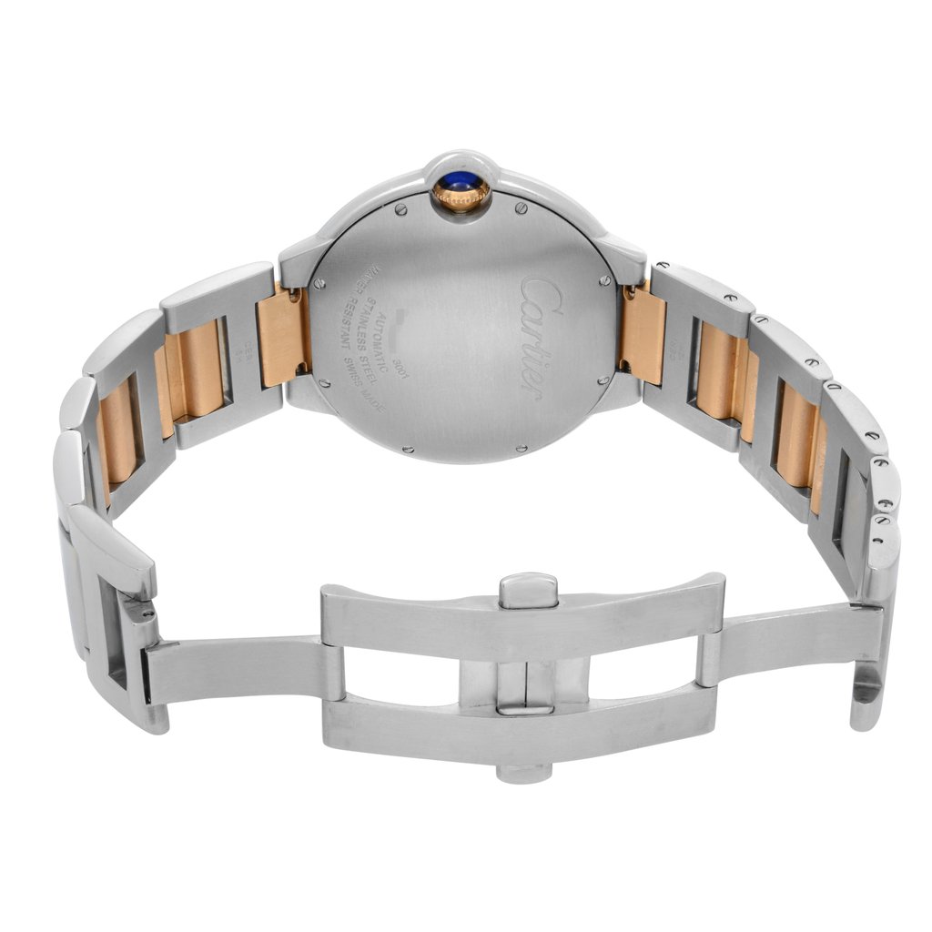 An image of a pre-owned Cartier men's wristwatch, captured from the back view with the clasp open. The watch is positioned centrally and photographed from directly above, showing the stainless steel caseback with the Cartier brand engraved. The screwback is visible, along with the blue cabochon crown on the side. The stainless steel and 18k rose gold band segments are visible, leading to the fold-over clasp with double push-button release. The round shape of the case is notable, and the watch is presented against a white background. The image is taken at close range, providing a clear view of the watch's details and materials.