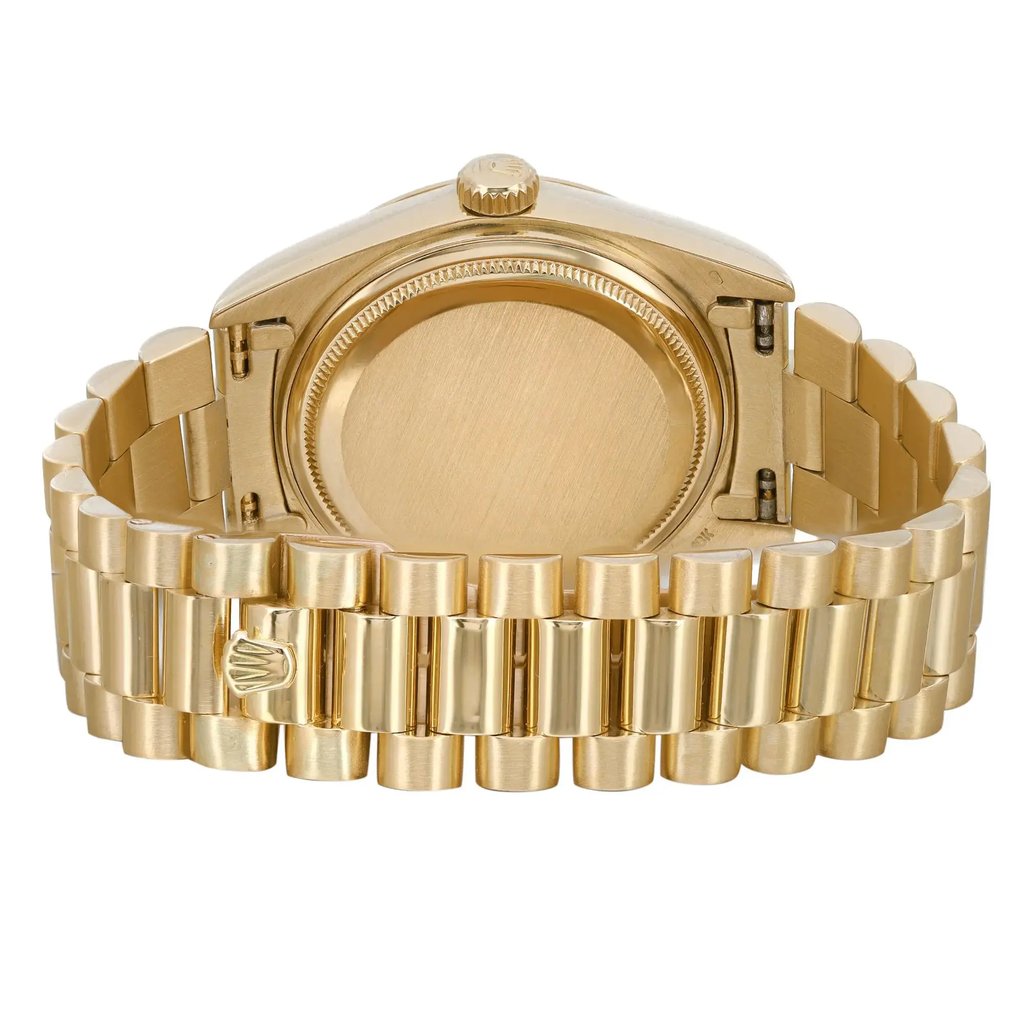 An image of a pre-owned Rolex men's wristwatch with a round shape, viewed from the back showing the solid caseback and closed fold-over clasp. The watch is made of yellow gold, featuring a polished finish, and is presented at a straight angle close-up, filling the frame for a detailed view. There may be light scratches on the case and bracelet Due to age.