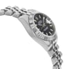 An image of a pre-owned wristwatch captured from a side profile view, opposite the crown. The watch features a silver metal band and a black dial with silver hour markers and hands. The angle highlights the watch's fluted bezel and the curved links of the bracelet. The photograph is taken at a close distance, emphasizing the sleek design and craftsmanship of the timepiece.