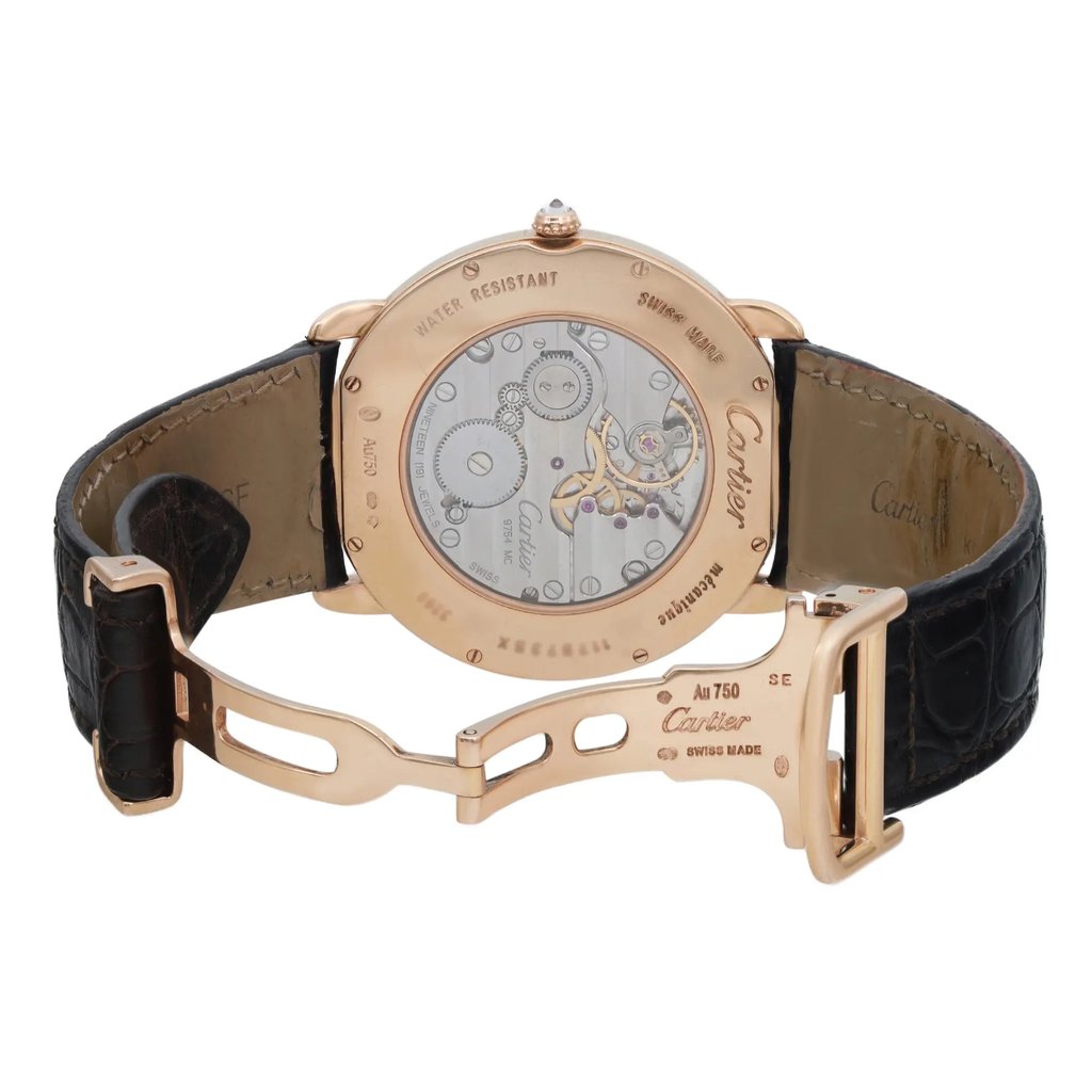 An image of a pre-owned wristwatch showing the back view with an open clasp. The watch is positioned at a slight angle, allowing a clear view of the intricate mechanical components through the transparent case back. The distance captures the entire watch, including the black leather strap and the gold-toned clasp.