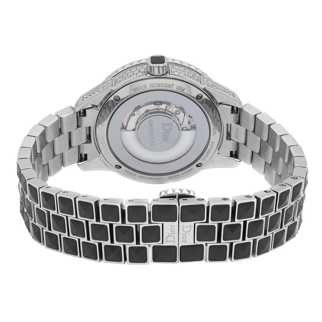 An image of a wristwatch taken from the back view, showcasing the clasp in a closed position. The watch is positioned centrally, with a slight angle highlighting the intricate details of the band and the back of the watch face. The shot is taken at a close distance, emphasizing the metallic finish and the design of the bracelet links. The watch appears to be in display model condition.