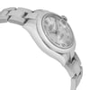 An image of a pre-owned wristwatch displayed in a side profile view, opposite the crown. The watch has a silver-toned case and bracelet with a classic design. The angle highlights the smooth contours and polished finish, with the face slightly tilted, showcasing the Roman numeral hour markers and date window. The photograph is taken at a close distance, emphasizing the watch's elegant details and craftsmanship.