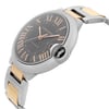 An image of a pre-owned Cartier men's luxury wristwatch with a side profile view showcasing the crown. The watch features a round stainless steel case with a sunburst brown dial and Roman numeral hour markers. The bezel is steel-colored, and the band is made of a combination of stainless steel and 18k rose gold. The watch is positioned at an angle that highlights the side profile, with a medium distance that clearly displays the details of the watch face and the point where the band connects to the case.