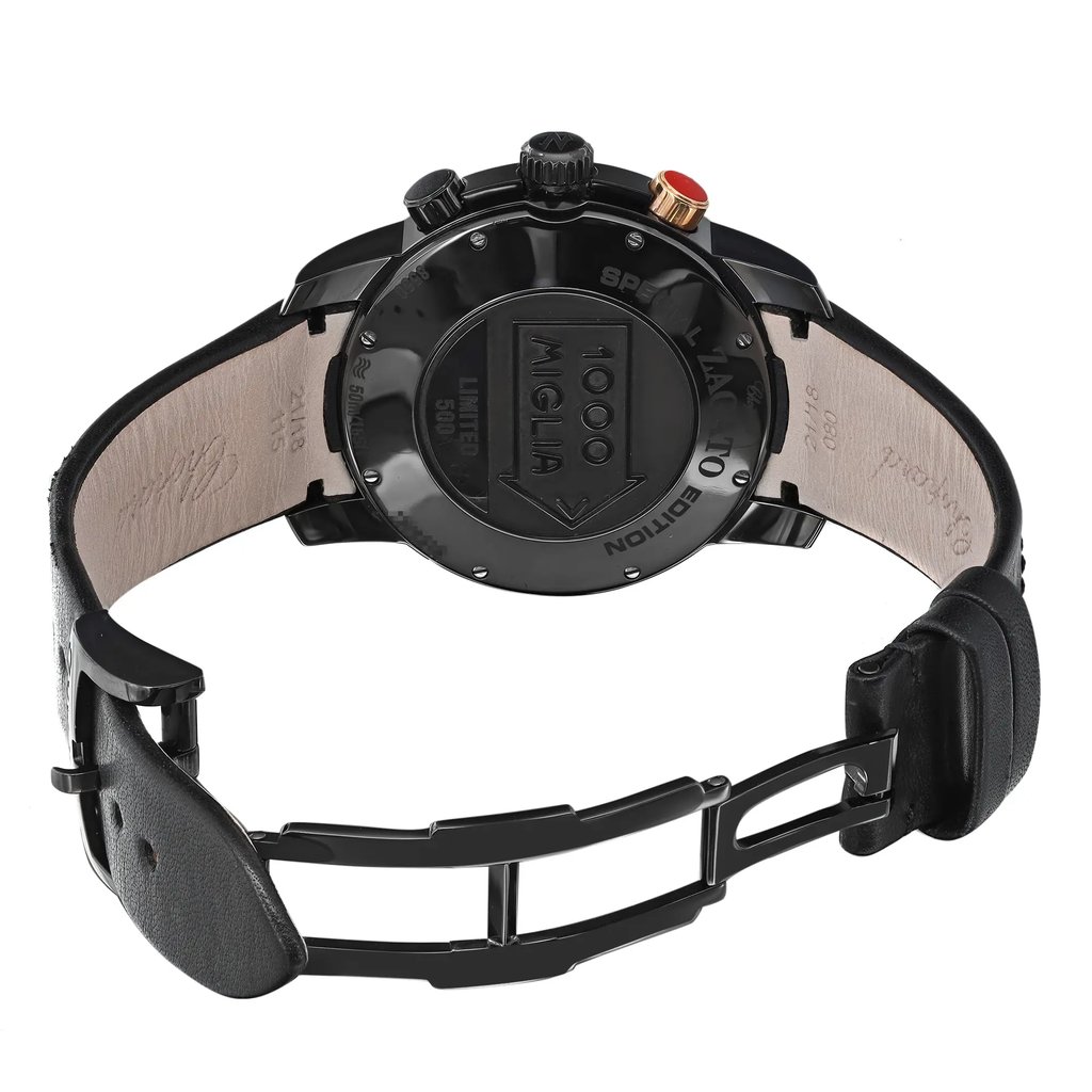 An image of a pre-owned wristwatch shown from the back view with an open clasp. The watch is positioned at a slight upward angle, allowing a clear view of the case back and the interior of the leather strap. The distance is close enough to see details such as the "1000 Miglia" engraving on the case back. The black leather strap and clasp are prominently visible, showcasing the design and condition of the watch.