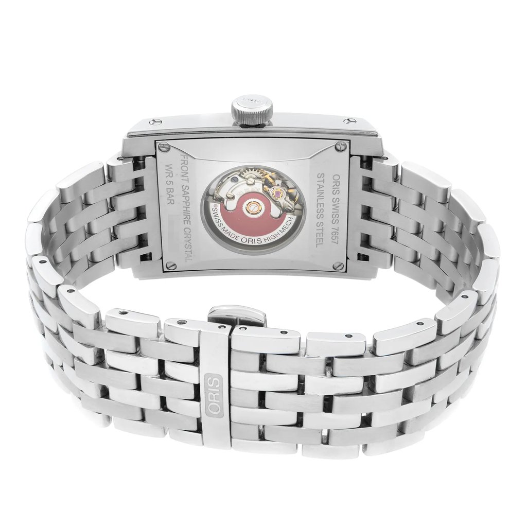 An image of a men's wristwatch viewed from the back, showcasing its rectangular stainless steel case and screwback. The watch is positioned upright with a focus on the double-locking fold-over clasp, which is partially open. The stainless steel band features a polished, linked design. The display model is captured at a close angle, highlighting the intricate details of the watch's mechanism visible through the caseback.