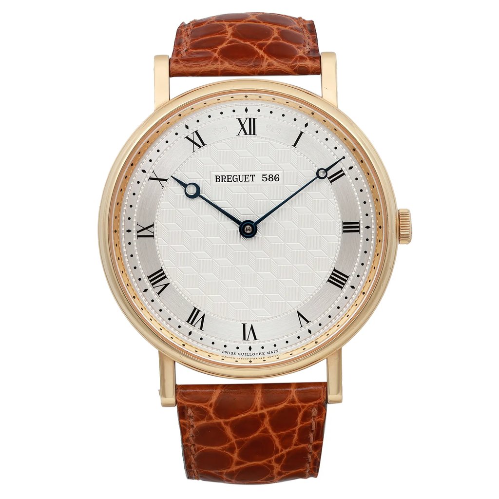 An image of a pre-owned Breguet men's luxury wristwatch in excellent condition, presented in a frontal full view. The watch features a round 41mm 18k yellow gold case with minor signs of wear, and a silver dial with a geometric pattern. It has a 12-hour dial marked by black Roman numerals and blue hands. The bezel is also gold and the unworn leather band has a brown crocodile pattern. The watch is displayed from a front angle at a close distance, showcasing the entire watch face and a portion of the band.