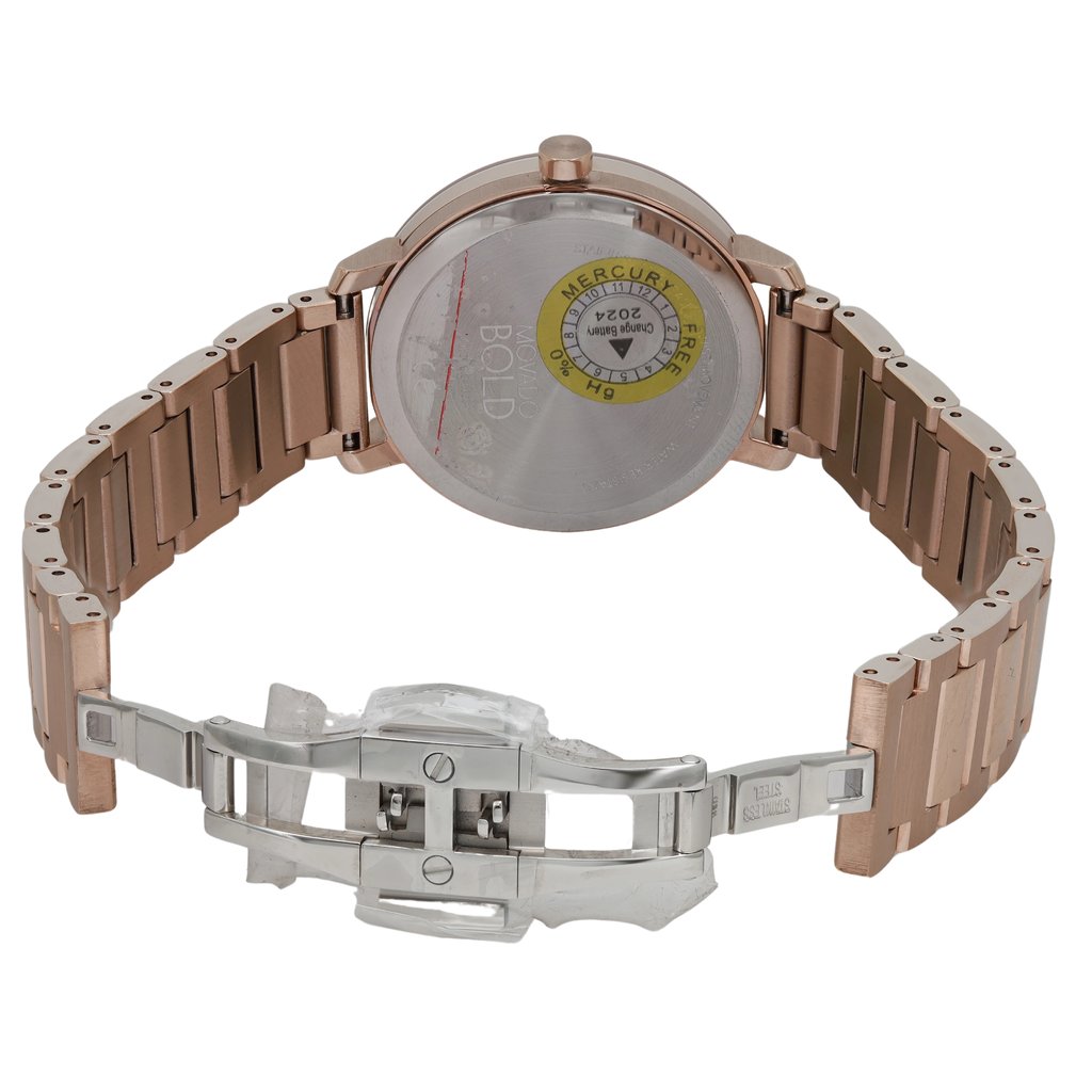 An image of a pre-owned wristwatch showcasing the back view with an open clasp. The watch is positioned at an angle that highlights the rose gold-toned metal bracelet and the stainless steel back of the watch case. The image is taken from a close distance, focusing on the intricate details of the clasp mechanism and the engraved markings on the watch back.