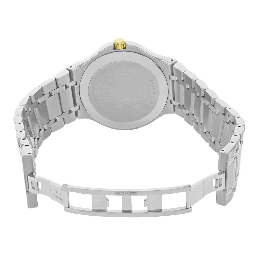An image of a pre-owned wristwatch showing the back view with an open clasp. The watch is positioned upright with the metal bracelet fully displayed. The clasp is open and visible, revealing the intricate links of the band. The image is taken from a straight-on angle at a moderate distance, highlighting the watch's stainless steel finish and the golden crown on the side.