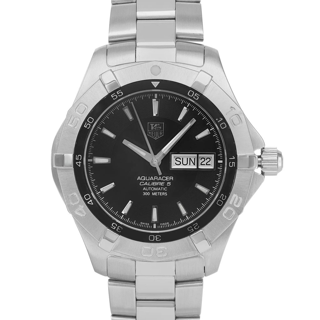 An image of a Wristwatch by TAG Heuer. This Pre Owned item is designed for Men, featuring a Dress/Formal style. It has a Mechanical (Automatic) movement and an Analog display with a Black dial color. The indices include 12-Hour Dial,Stick Indexes. The band is made of Stainless Steel and the case is made of Stainless Steel. The watch has a Round shape with a case size of 41 mm and a case thickness of 12 mm.