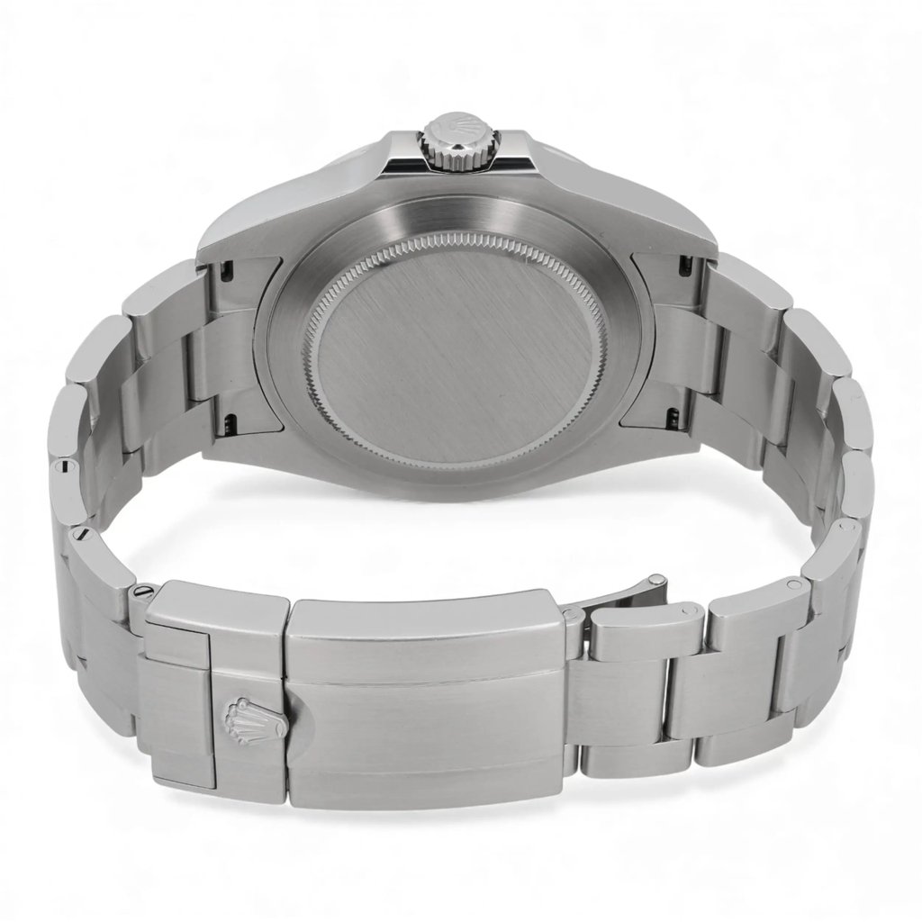 An image of a pre-owned men's Rolex wristwatch viewed from the back. The watch is positioned horizontally, showcasing its metal bracelet and clasp. The crown is visible at the top center, with the watch slightly angled to reveal the brushed metallic finish. The image is taken at a close distance, highlighting the details of the bracelet and the closed clasp.