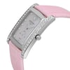 An image of a wristwatch in an unworn condition, showcasing a side profile view. The watch features a pink leather strap and a rectangular, silver-toned case adorned with small, sparkling stones along its edges. The crown is prominently visible on the side. The dial is minimalistic with a subtle heart design and silver hour markers. The photograph captures the watch from a close distance, highlighting its elegant craftsmanship and luxurious detailing.