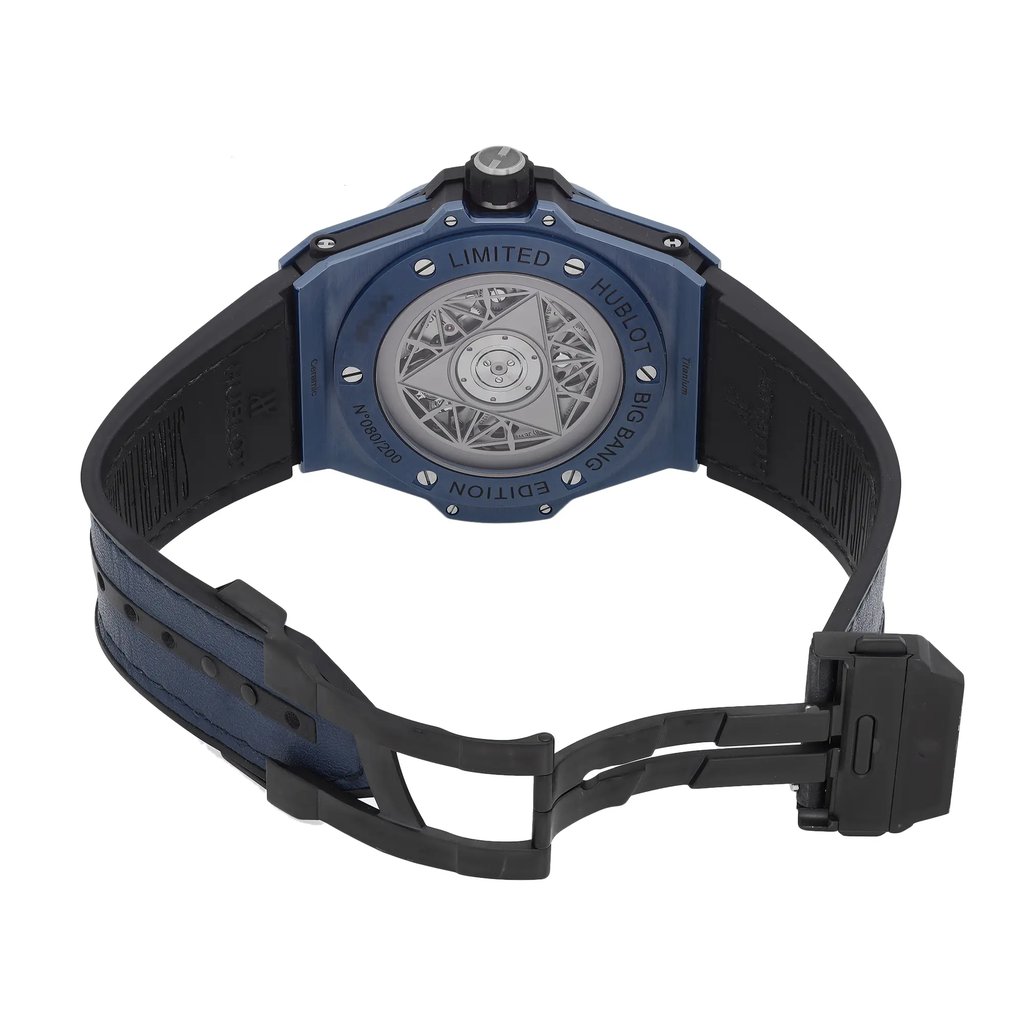 An image of a pre-owned wristwatch showing the back view with an open clasp. The watch has a blue and black color scheme, featuring a visible intricate design on the case back. The watch is positioned at a slight angle, providing a clear view of the back, with the clasp open in the foreground, indicating the watch's limited edition status.