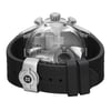An image of an unworn Edox men's wristwatch, viewed from the back angle showing the stainless steel caseback with an exhibition design. The watch is positioned horizontally with the round shape and rubber band clearly visible. The fold-over clasp with double push-button is in the closed position, and part of the band loops around the watch, creating a layered appearance. The image is taken from a close distance, highlighting the details of the clasp and texture of the rubber band.