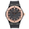 An image of a pre-owned men's Hublot Classic Fusion Ceramic King 18K Rose Gold Black Dial Watch  captured from a frontal angle at a close distance. The watch features a black leather strap and a round face with a rose gold bezel. The dial is dark with rose gold hour markers and hands, and includes a date indicator at the 3 o'clock position.