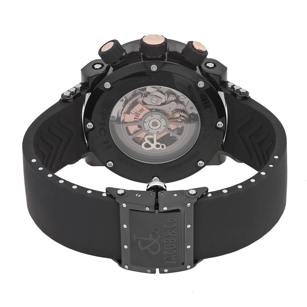 An image of a pre-owned wristwatch shown from the back view, highlighting the intricate mechanics through a transparent case back. The watch is positioned upright with the clasp closest to the viewer. The angle captures the full circular back and the closed clasp, featuring the brand's engraving. The image is taken from a close distance, emphasizing the watch's detailed craftsmanship and the design of the black strap.