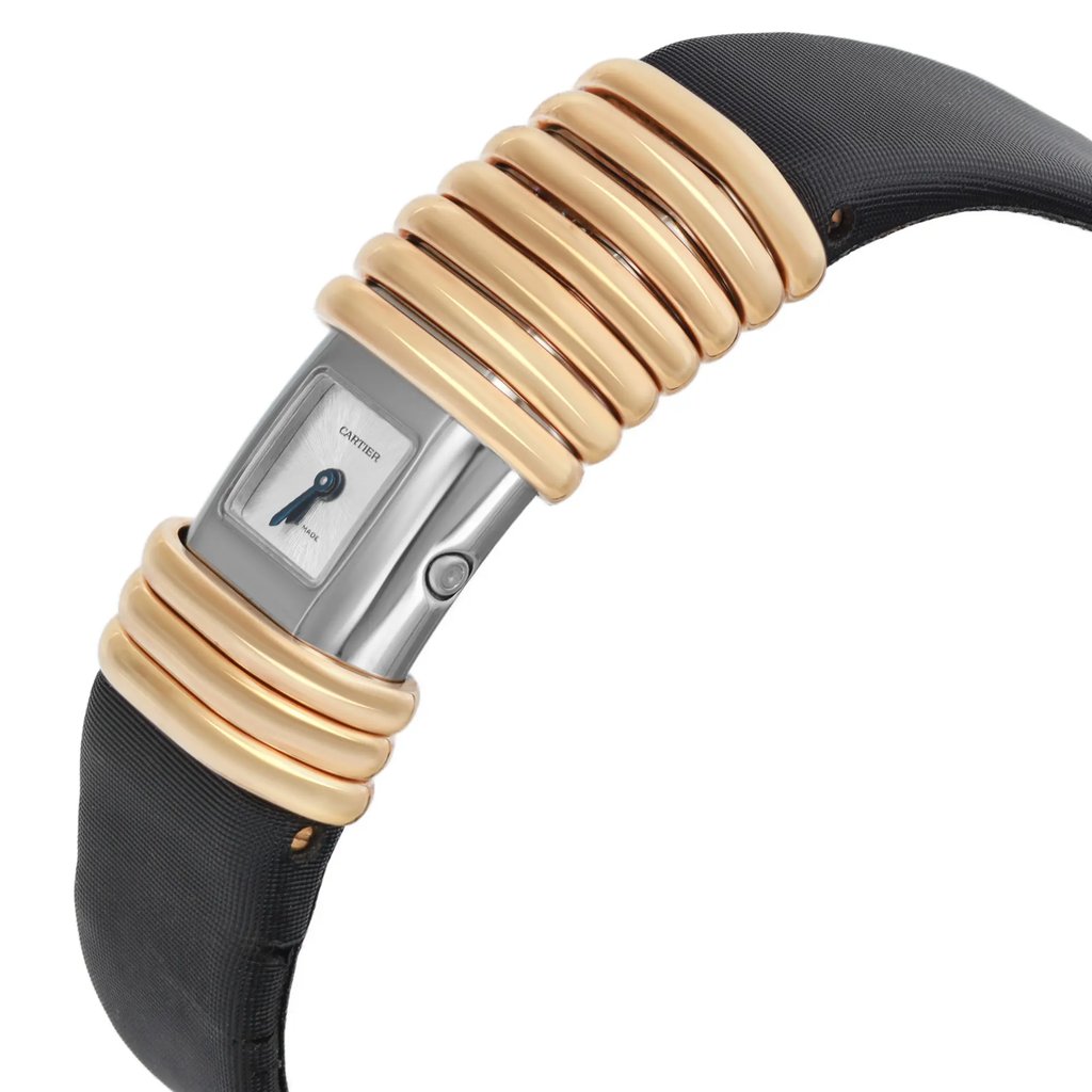 An image of a pre-owned wristwatch shown from a side profile view. The watch face is visible with the crown prominently displayed on the side. The band features alternating gold and black segments, giving it a distinctive appearance. The angle highlights the curvature of the watch and its sleek design, photographed from a close-up distance.