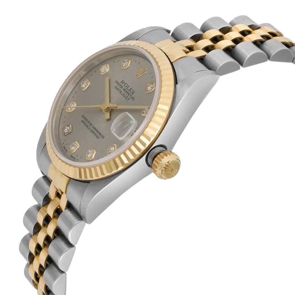 An image of a pre-owned wristwatch shown from a side profile view, highlighting the crown. The watch features a two-tone metal bracelet with alternating gold and silver links. The case has a fluted gold bezel and a dial adorned with diamond hour markers. The angle captures the crown prominently and offers a detailed view of the watch's elegant design.