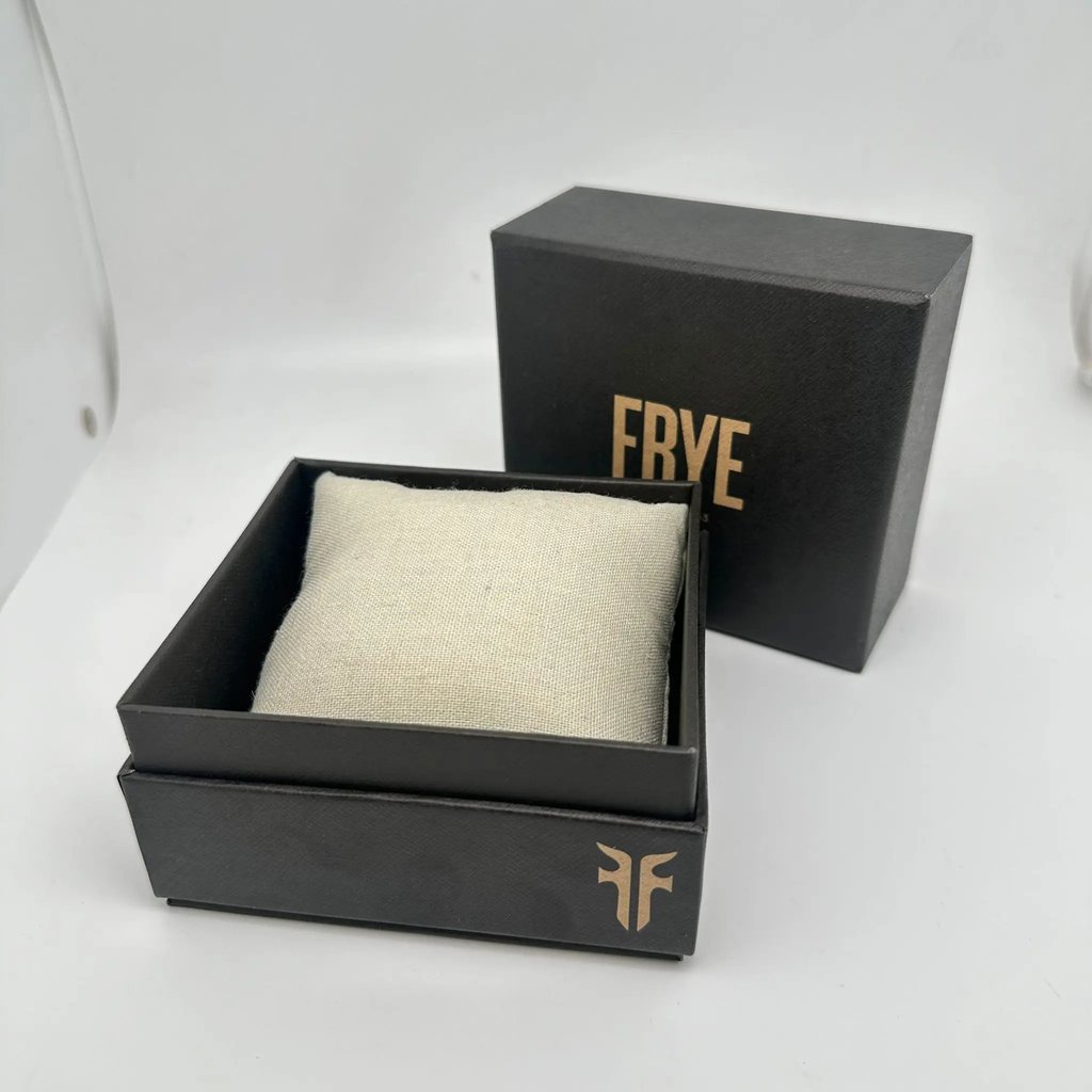 An image of a Wristwatch by Frye. This Unworn item is designed for Men, featuring a Casual style. It has a Quartz movement and an Analog display with a Black dial color. The indices include 12-Hour Dial,Easy to Read/Large Numerals. The band is made of Leather and the case is made of Stainless Steel. The watch has a Square shape with a case size of 40 mm and a case thickness of 11 mm.