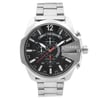 An image of a Wristwatch by Diesel. This Display Model item is designed for Men, featuring a Casual,Sport style. It has a Quartz movement and an Analog display with a Black dial color. The indices include 12-Hour Dial,Arabic Numerals,Multi Dial,Non-Numeric Hour Marks. The band is made of Stainless Steel and the case is made of Stainless Steel. The watch has a Round shape with a case size of 53 mm and a case thickness of 14 mm.