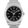 An image of a pre-owned men's Rolex wristwatch, viewed from the front in a close-up shot. The watch features a round black dial with stick indexes and a gray bezel. The band and case are made of stainless steel, reflecting a casual style in good condition.