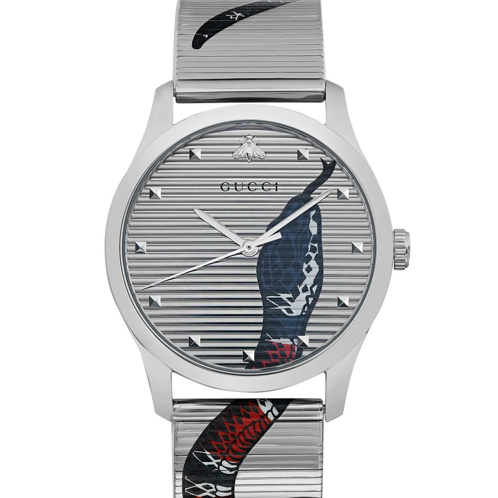 An image of an unworn Gucci wristwatch shown in a front close-up view, highlighting its round silver dial with an animal print pattern and 12-hour indices. The watch has a stainless steel case and band, and is styled in a casual unisex fashion. The photo is taken from a direct frontal angle, focusing on the watch face and a portion of the band, showcasing the watch's excellent condition.