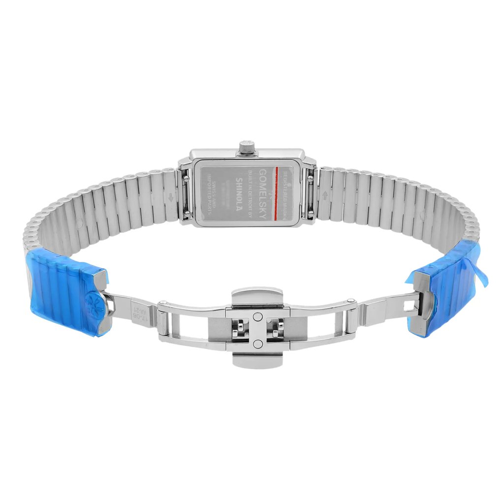 An image of a wristwatch from the back view, showing an open clasp. The watch is unworn and positioned with the metal strap forming a near-complete circle. Protective blue film is visible on the ends of the strap. The image is taken from a straight-on angle at a close distance, highlighting the details of the clasp and the back of the watch case.