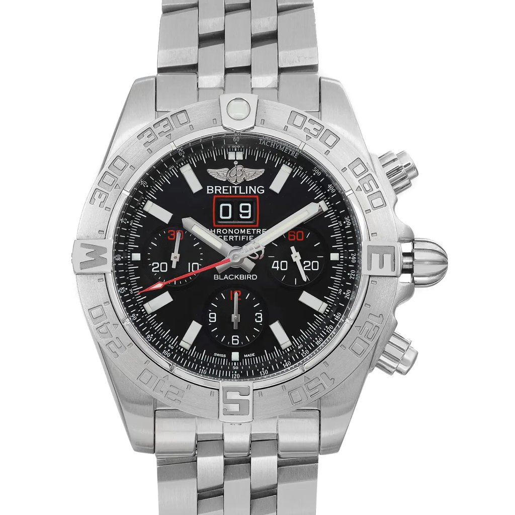 An image of a pre-owned Breitling men's wristwatch in good condition, featuring a pilot/aviator style. The watch is captured in a front close-up shot, with the watch face and part of the stainless steel band visible. The round case and bezel are stainless steel with a gray color, and the dial is black. The watch has a 12-hour dial with stick indexes, a seconds hand, and additional features including a chronograph, date indicator at the 12 o'clock position, luminous hands, and a small seconds subdial. The inner bezel features tachymeter markings, and the watch has prominent pushers and a crown on the right side. The Breitling logo and model name "BLACKBIRD" are visible on the dial.