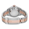 An image of a pre-owned Rolex women's wristwatch viewed from the back, showing the screwback case and the fold-over clasp closure. The watch is positioned horizontally in the center of the frame, with a close-up angle that provides a clear view of the materials. The case is made of stainless steel and the band features a combination of stainless steel and rose gold, reflecting a luxurious two-tone design. 