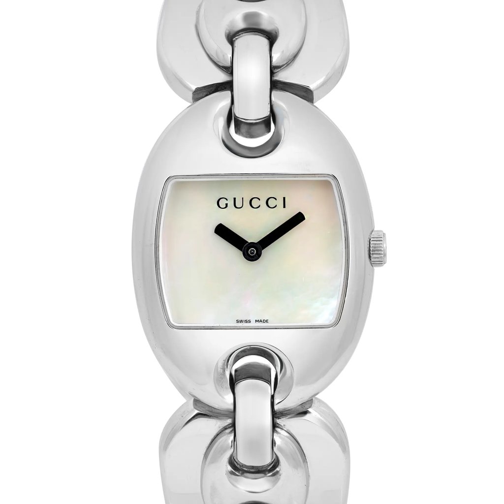 An image of a pre-owned Gucci women's wristwatch taken from a front-facing angle. The watch features a shiny silver-tone case and bracelet links. The dial has a mother-of-pearl finish with black hour and minute hands and the brand name "GUCCI" at the top. The watch is shown in close-up, highlighting its elegant design and craftsmanship.