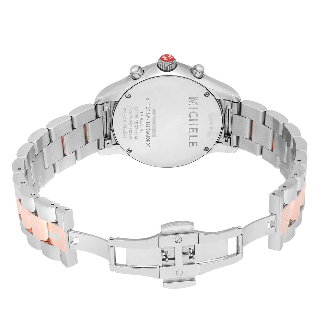 An image of a pre-owned wristwatch showing the back view with an open clasp. The watch is positioned centrally, with the angle capturing the full bracelet spread out. The image is taken from a close distance, highlighting the metallic links and the engraved details on the case back.