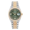 An image of a pre-owned men's Rolex Datejust 36mm Steel 18k Yellow Gold Green Diamond VI IX Dial Watch, viewed from a straight-on angle, showcasing its detailed features. The watch has a green dial with Roman numeral hour markers and a date indicator at the 3 o’clock position. It features luminous hands and a two-tone bracelet made of gold and stainless steel links. The bezel is gold, adding a touch of elegance to the design. The image is taken from a close distance, highlighting the intricate details of the watch face and band.
