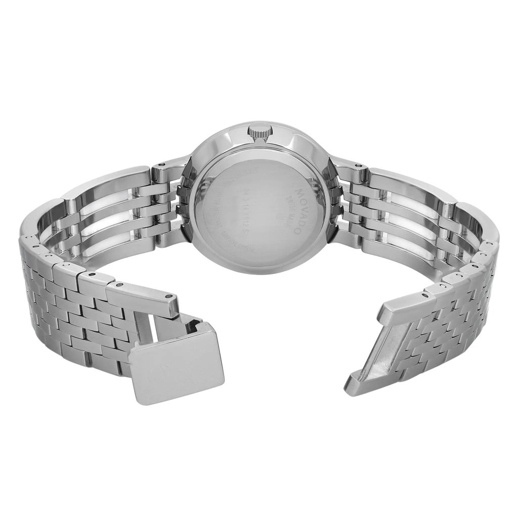 An image of a pre-owned Movado women's wristwatch viewed from the back. The stainless steel case is round with a snap caseback. The band, made of ceramic and stainless steel, is open with a visible jewelry clasp. The watch is positioned at eye level, with the angle slightly tilted to showcase the open clasp and the intricate band design. The distance allows for a clear view of the watch's details.
