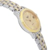 An image of a new wristwatch captured from a side profile view, opposite of the crown, showing a stainless steel and gold-tone bracelet. The watch face is angled slightly towards the camera, revealing a gold dial with minimalistic hour markers and a date window. The photograph is taken at a close distance, highlighting the watch's elegant design and craftsmanship.
