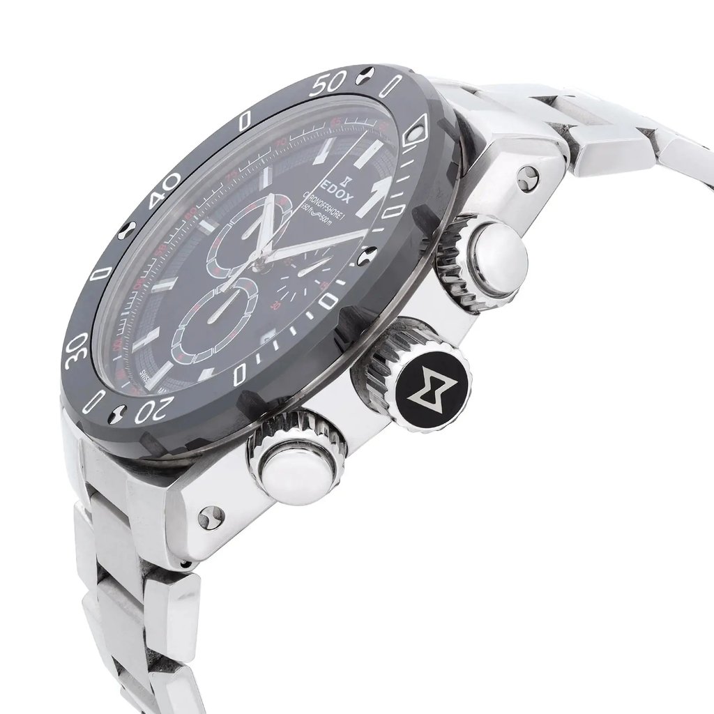 An image of a wristwatch from a side profile view, showcasing the crown prominently. The watch is a display model, featuring a metallic strap and detailed bezel. The angle highlights the textured crown and side buttons, with a focus on the watch's sleek design and craftsmanship. The watch face is visible, emphasizing its sophisticated and modern aesthetic.