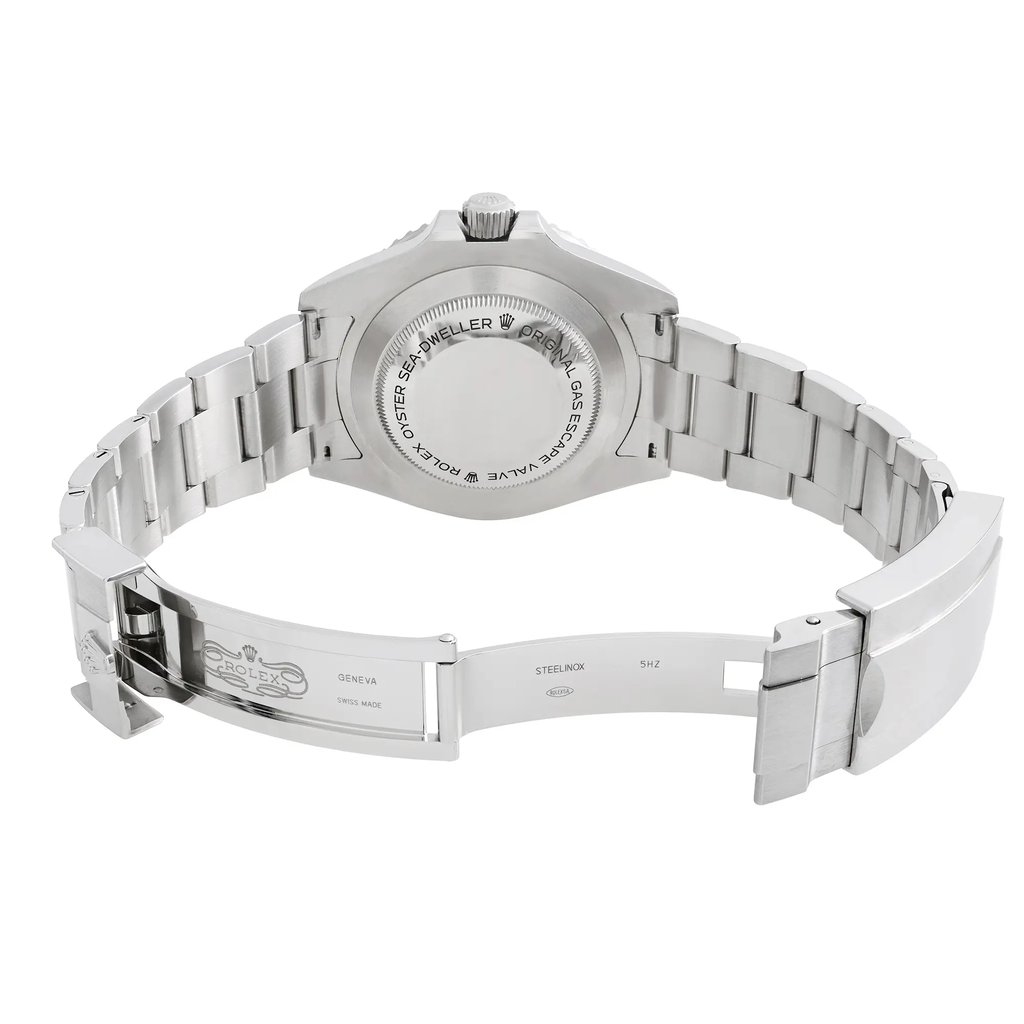 Back View Of Solid Back Case And Open Stainless Steel Band Of Rolex 126600 Watch Display Model Condition