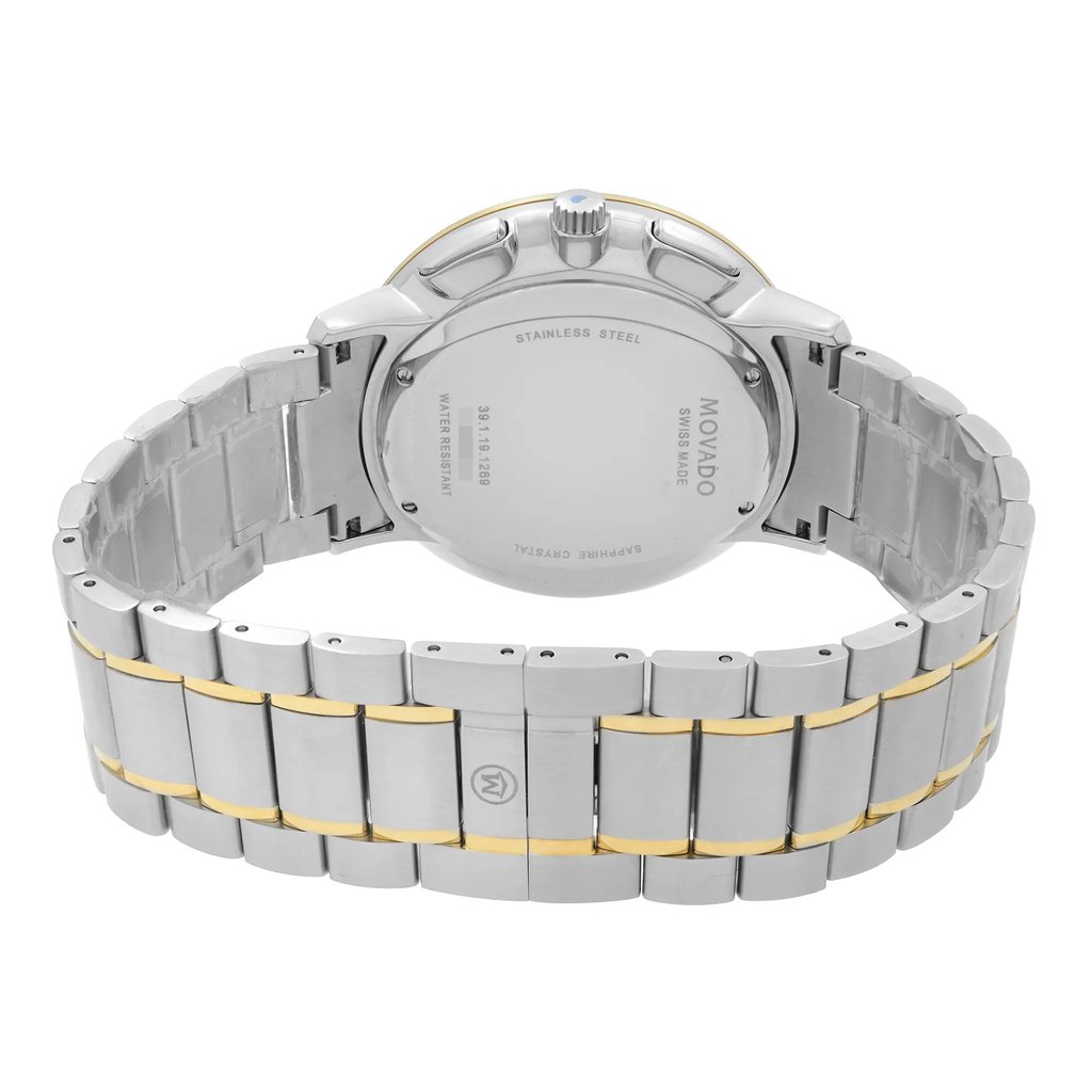 An image of a wristwatch showcasing the back view and closed clasp. The watch features a stainless steel band with gold accents, viewed from a centered angle at a close distance. The case back displays engraved details, and the condition is noted as new with defects.